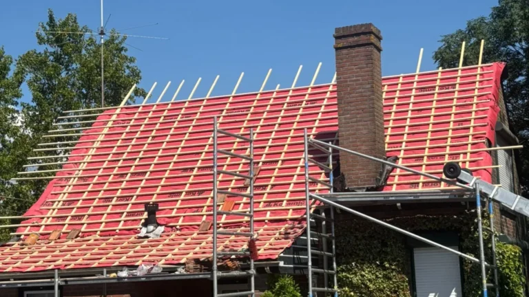 Stripped tiled roof with new waterproof underlay, battens, and purlins during roof renovation